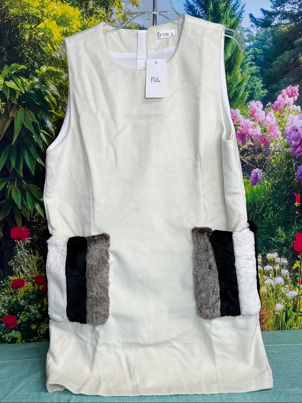 Mulla Cream Sleeveless Shift Dress with Faux Fur Pocket Accents. #2222